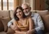 How to Maintain Passion in a Long-term Marriage? What the Pattern Usually Means—and What to Do Next Two adults smiling and embracing while sitting together on a sofa.