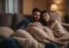 Barriers to Intimacy: Why Connection Fades—and How Couples Can Find It Again Two adults leaning against each other on a sofa beneath a soft blanket.