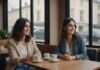 Dating Trends 2026: What to Notice Before the Pattern Becomes the Relationship Two women smiling together at a cafe table beside plain white cups.