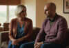 Emotional Cheating, Trust Breaks, and the Gray Areas of Modern Relationships Two adults having a serious conversation on a sofa.