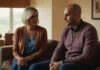 Emotional Cheating, Trust Breaks, and the Gray Areas of Modern Relationships Two adults having a serious conversation on a sofa.