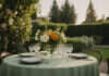 Child-Free Weddings, Social Media Aesthetics, and Unreasonable Family Requests An outdoor wedding table with flowers and plain place settings.