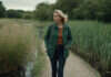 Why Your Heart Still Aches for the Man Who Broke It A woman taking a solitary walk beside a quiet stream.