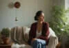 Body Autonomy, Hidden Surgery & Trust | Bella Kent Woman sitting quietly in a bright room.