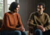 Can a Marriage Heal While an Emotional Affair Continues? Two adults having a thoughtful conversation in a quiet room.