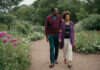 Black Cat Girlfriend Golden Retriever Boyfriend: The Internet Made It Viral. Here’s What It Means in Real Relationships Two adults walking together through a garden.