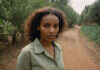 Making Consistency Feel Natural Through Routine Tracking Woman walking along a leafy park path.