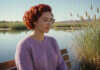 Check-In Questions for Months When Nothing Seems Wrong Woman standing beside a lake.