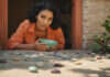 Healthy Relationship Habits: What It Looks Like in Real Life—and Why the Small Details Matter Woman placing smooth pebbles in a bowl.