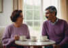 Relationship Stages and What They Mean Two adults talking outdoors while holding plain cups.