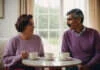 Relationship Stages and What They Mean Two adults talking outdoors while holding plain cups.