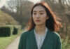 Intimacy and Mental Health: What Creates Real Closeness Beyond Date Night A woman taking a quiet pause on a garden path.