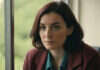Gaslighting: What to Notice Before the Pattern Becomes the Relationship A woman looking thoughtfully toward a window.