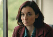 Gaslighting: What to Notice Before the Pattern Becomes the Relationship A woman looking thoughtfully toward a window.