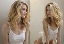 The Longest Relationship You Rarely Examine: Yourself Woman looking at her reflection in a mirror beside a bright window.